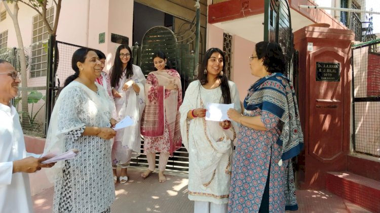 voter information slips are being given to voters from door to door   they are being motivated to vote